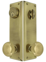 Quincy Entry Door Set with Providence Knobs in Antique Brass.